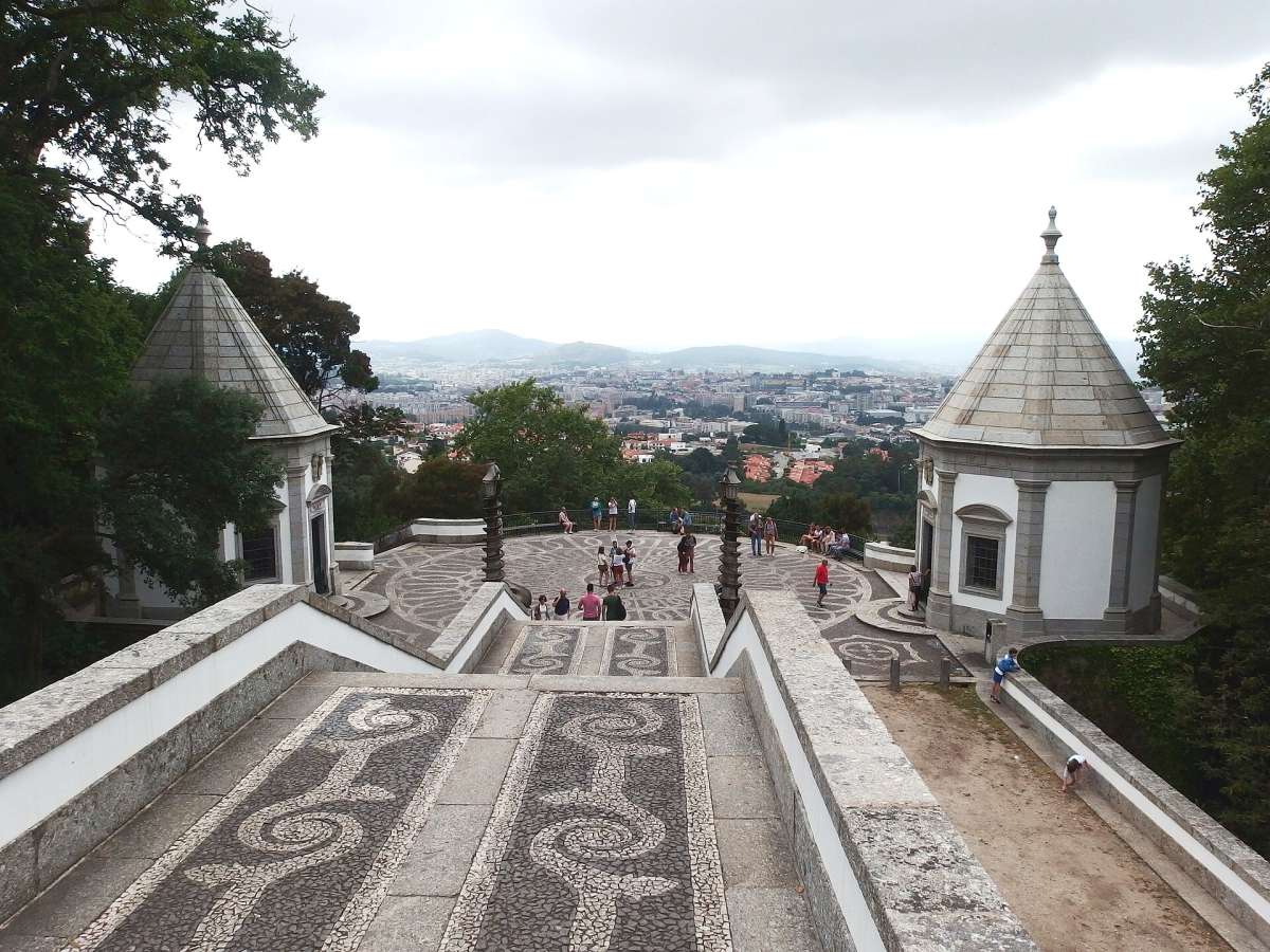 The patterned stone stairway of Bom Jesus do Monte above Braga, with the city in the distance
