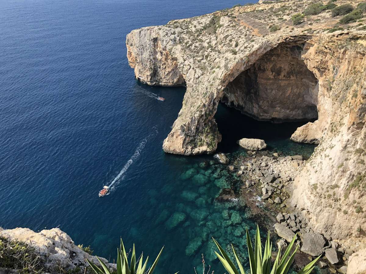 Limestone sea arch and deep blue Mediterranean water on the Zurrieq coast, Malta